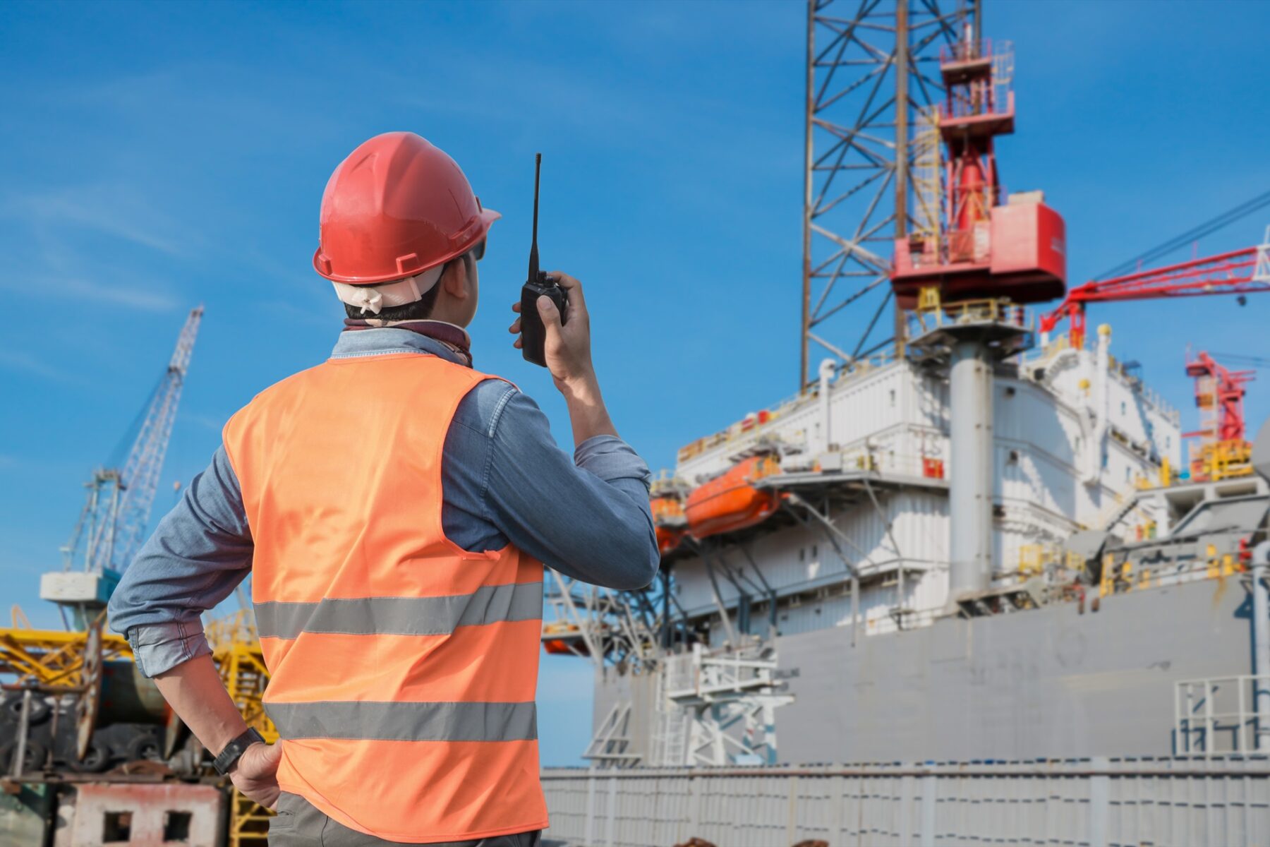 Workers,Hand,Holding,Walkie,Talkie,Control,Work,In,Shipyard