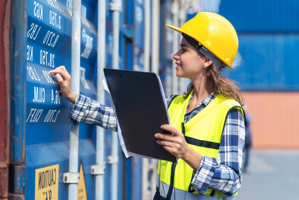 Women,Engineer,Wears,Ppe,Checking,Container,Storage,With,Cargo,Container